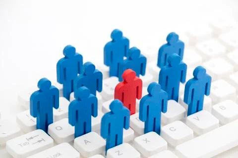 Unique person in the crowd on computer keyboard Stock Photos