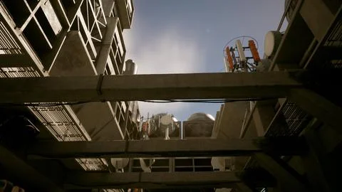 A unique perspective of a building's concrete roof, captured from below Ilustración de archivo