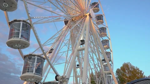 Unique perspective, close up of spinning Ferris wheel with glass cabins Stock Footage 180002852