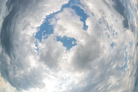Unique perspective of cloud layers, circular shape, contrasting brightness .. Stock Photos