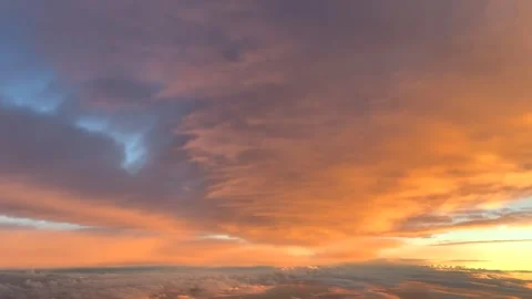 Unique Pilot View Flying Under a Broken Layer of Golden Clouds at Sunset. Jet 스톡 동영상 348333728