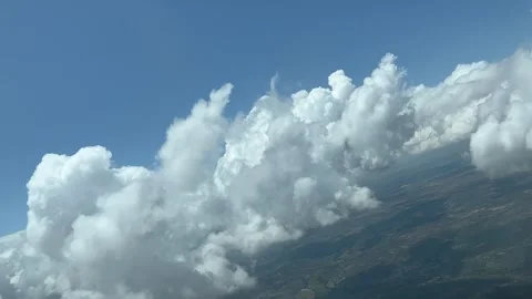 Unique pilot’s perspective while flying trough a sky with some fluffy tiny Stock Footage 243242296