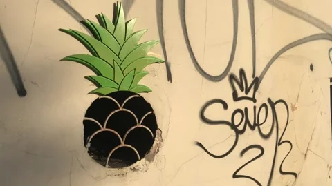 Unique pineapple street art on a graffiti wall Stock Footage 342645069