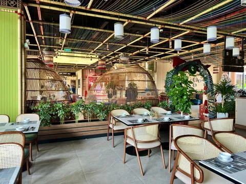 Unique private dining areas inside large bamboo basket structures at Flamingo Stock Photos