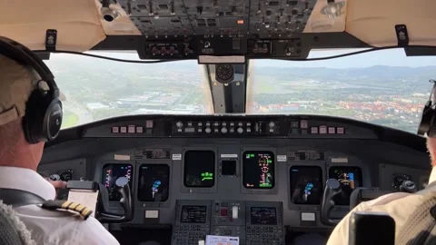 Unique real cockpit view during a bumpy approach to Bilbao’s airport, in Stock Footage 221883273