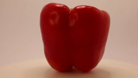 Unique red bell pepper shaped like a heart captured in a creative culinary displ Stock Footage 328633758