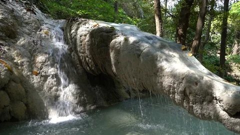 A Unique Rock Formation Connected to a Waterfall Stock Footage 74291111