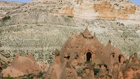 Unique Rock Formations and Ancient Cave Dwellings in Zelve Valley, Cappadocia, T Stock Footage 332544720