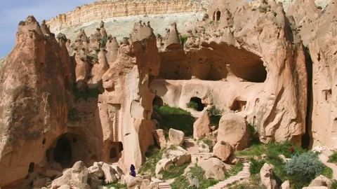 Unique rock formations and ancient cave dwellings in Zelve Valley, Cappadocia, T Stock Footage 332544779