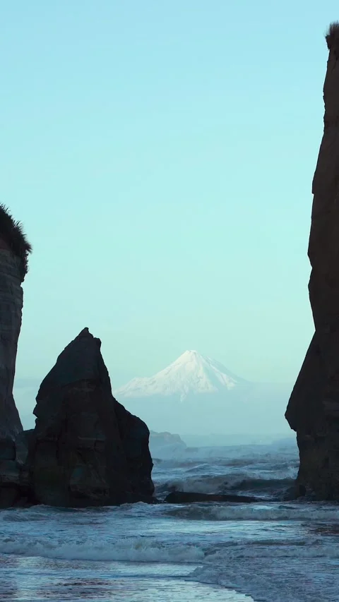 Unique rock formations by the beach known as Three Sisters and the Mount Ta.. Stock Footage 289102523