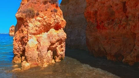 Unique rock formations create a natural spectacle at Praia Do Camilo, Stock Footage 251549143