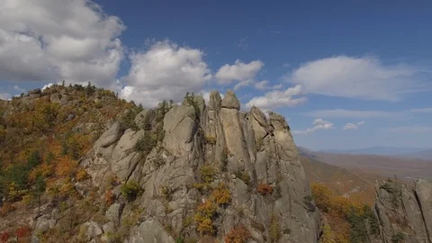 Unique rock formations groups stones mountains Autumn Park Dragon Russia Drone Stock Footage 98917551