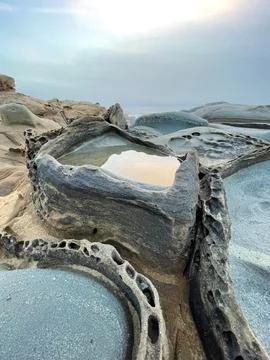 Unique rock formations with shallow pools of water at Salt Point State Park.. Foto stock