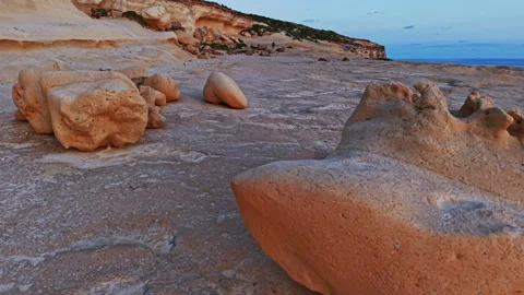 Unique rock formations at sunset along Malta's coastline Stock Footage 306641913
