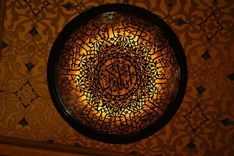 A unique round chandelier with Arabic patterns inside Katara Mosque, locate.. Stock Photos