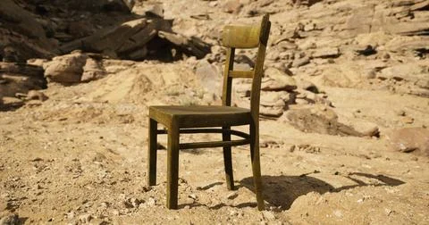 Unique rustic chair positioned in a sandy landscape surrounded by rocks 库存插图