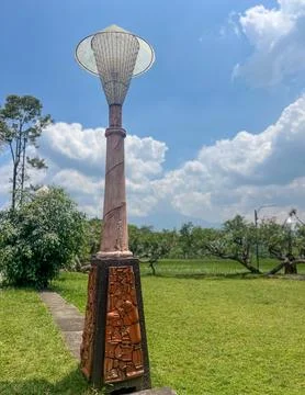 Unique Rustic Outdoor Lamp Post Under Bright Blue Sky Stock Photos