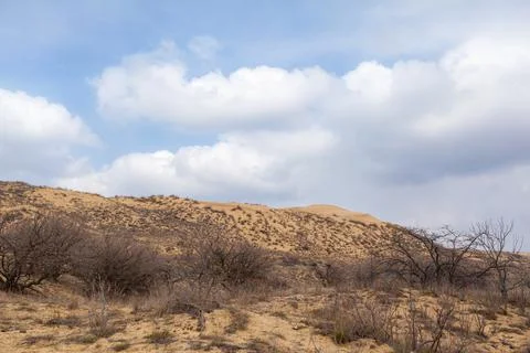 A unique sandy mountain in the Caucasus on a cloudy day. Stock Photos