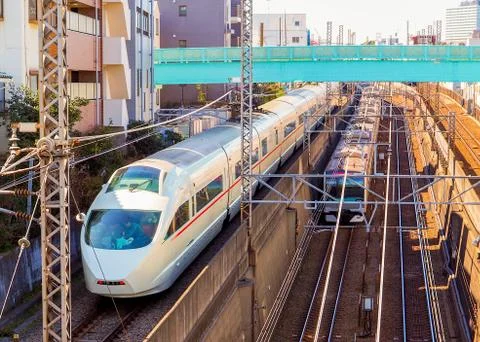 A unique scene of two trains passing at two different levels. Stock Photos