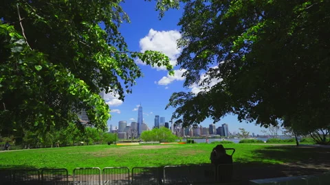 Unique shape clouds float over the Lower Manhattan skyscraper NYC. Stock-Footage 155411494