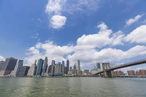 Unique shape summer clouds float over the Lower Manhattan skyscraper NYC 스톡 사진