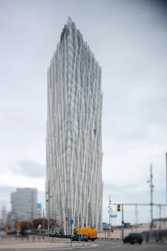 Unique skyscraper with a distinctive facade stands tall in Barcelona's urba.. Stock Photos