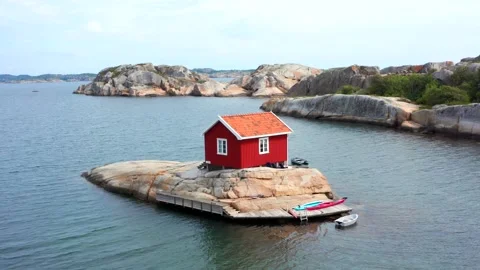Unique special summer house cabin Norway fjord. tiny island big smooth rock Stock Footage 319687370