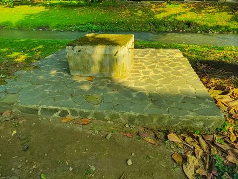 Unique Stone Bench Seating with Artistic Stone-Paved Garden Floor in Park Stock Photos