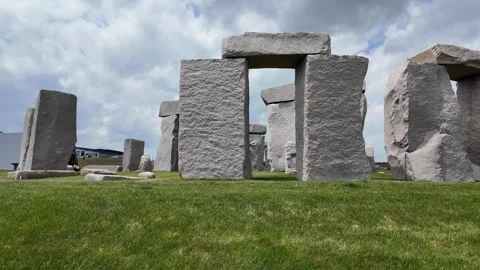 Unique Stone Formation Against a Dramatic Sky Stock Footage 313838193