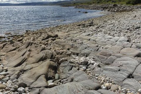 Unique stone pavement on a remote beach Foto stock