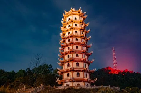 A   unique   structure   lit   up   at   twilight Stock-Fotos