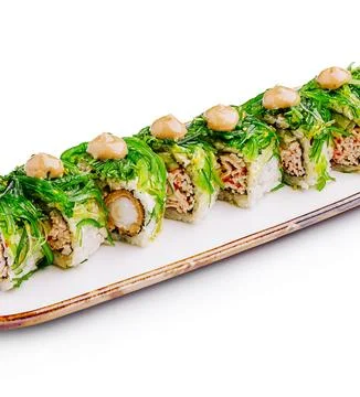 Unique sushi roll presentation featuring fresh ingredients on a white platter Stock Photos