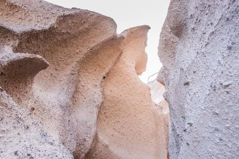 Unique texture of the sandstone cliffs of Santorini island, Greece. Stock Photos