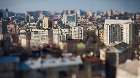 Unique tilt-shift perspective of a vibrant Kyiv city street scene Photos