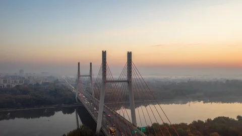 Unique time lapse of trafic on a busy bridge during sun rise Stock Footage 99061332
