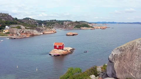Unique tiny summer cottage house cabin in Norwegian fjord. Small island Stock Footage 319687308