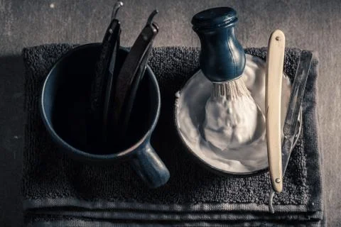 Unique tools for barber. Sharp razor, soap and brush Stock Photos
