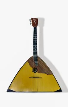 Unique triangular string instrument displayed prominently against a plain b.. Foto stock