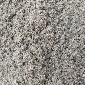 Unique unfinished wall texture, with a layer of sand Stock Photos