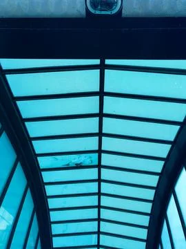 Unique view of an architectural structure showcasing a glass roof at an ind.. Stock Photos