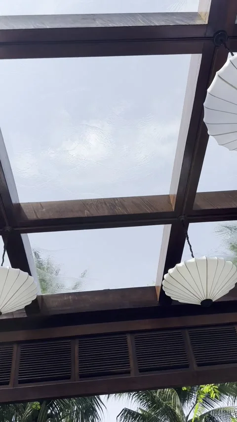 Unique view looking up through a wooden structure featuring white umbrella Vídeo Stock 342963910