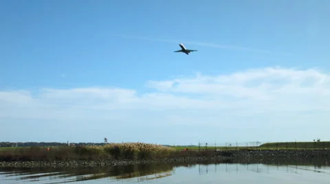Unique view from the river of the jet airplane taking off Stock Footage 56785328