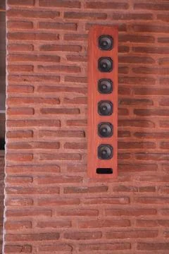 Unique wall-mounted speaker in modern setting 写真素材