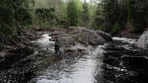 Unique waterfall on a small river 4k, slow-mo Stock Footage 243529036