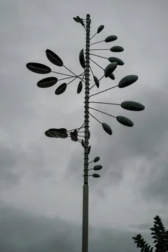 Unique Wind Vane Design Under Gloomy Sky Stock Photos