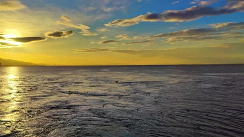 Unique Yellow and Blue Sunset in the Ocean Stock Footage 296849478