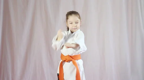 Unit and punch performs girl with orange belt Stock Footage 35357317