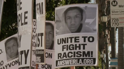 "UNITE TO FIGHT RACISM" Sign Stock Footage