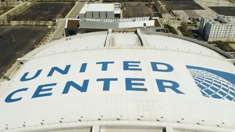 United Center Pull Away, Pan Up to Reveal Chicago Skyline Video stock 106876386