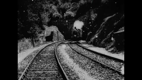 UNITED KINGDOM - 1899 - A locomotive train approaches and enters a dark tunnel Stock Footage 340571753